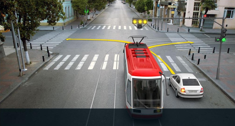 Which vehicle driver is allowed to proceed to the arrow direction at this signal of the traffic lights?